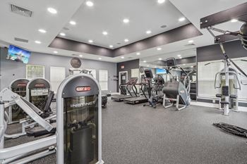 fitness center with free weight and cardio equipment